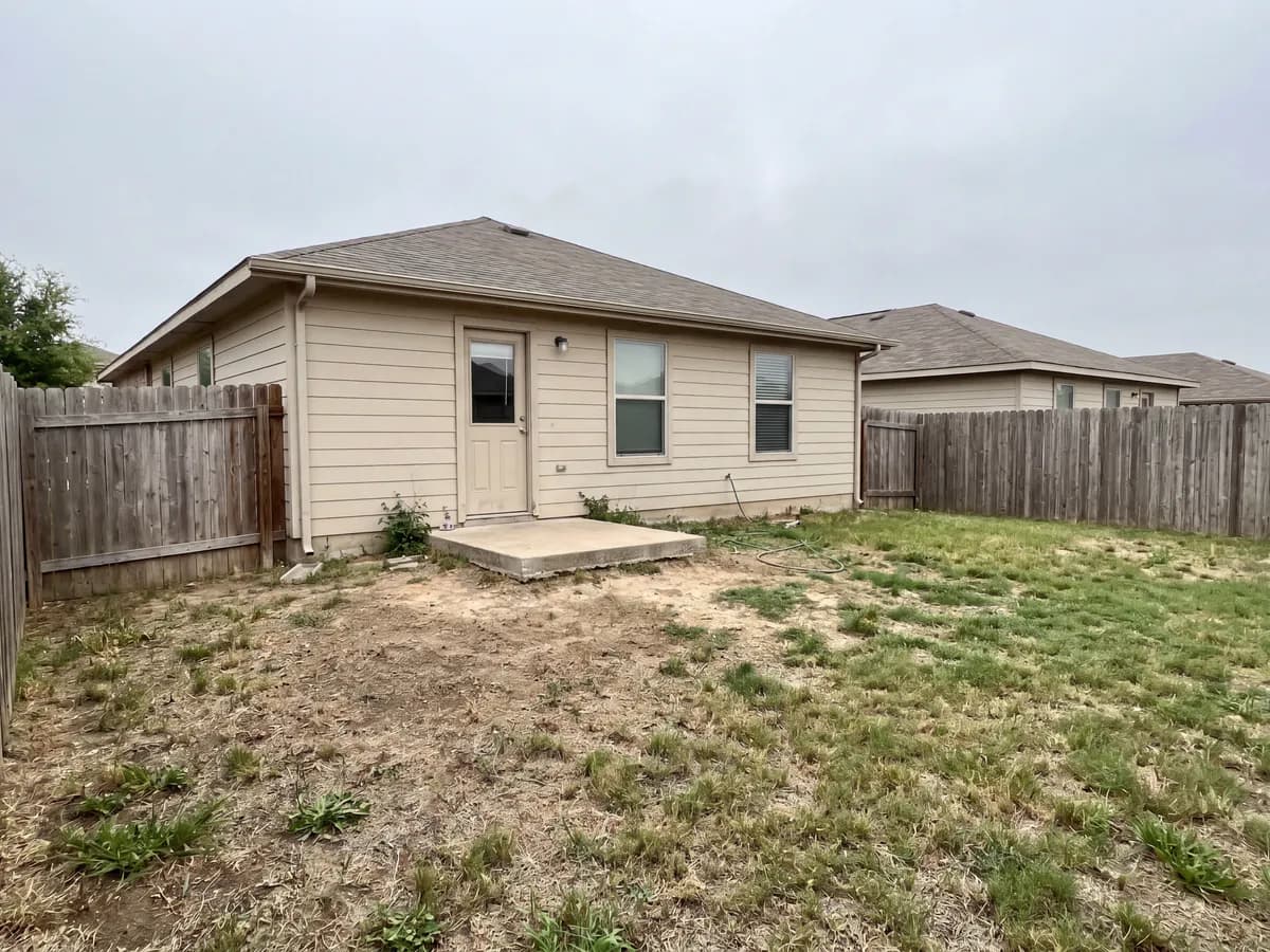 AI deck design before and after: the back of a house photo redesigned with a new deck and layout.