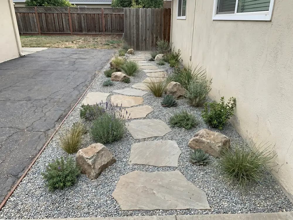 A backyard landscape design generated by OutdoorBrite from the owner's photo
